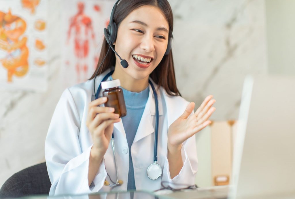 Female doctor conducting online teleconsultation in Singapore clinic