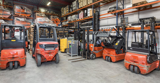 Forklift machinery in warehouse