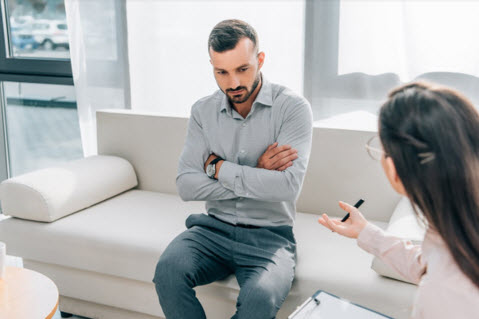 psychologist and patient talking in clinic mental