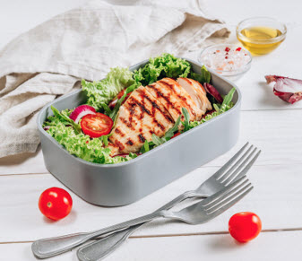 lunch boxes with chicken and salad