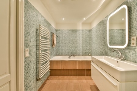 Interior of modern light bathroom with toilet