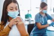 Doctor administering travel vaccine in Singapore