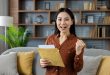 A woman happily holding a document envelope after successful delivery to Malaysia by Evermarch Logistics