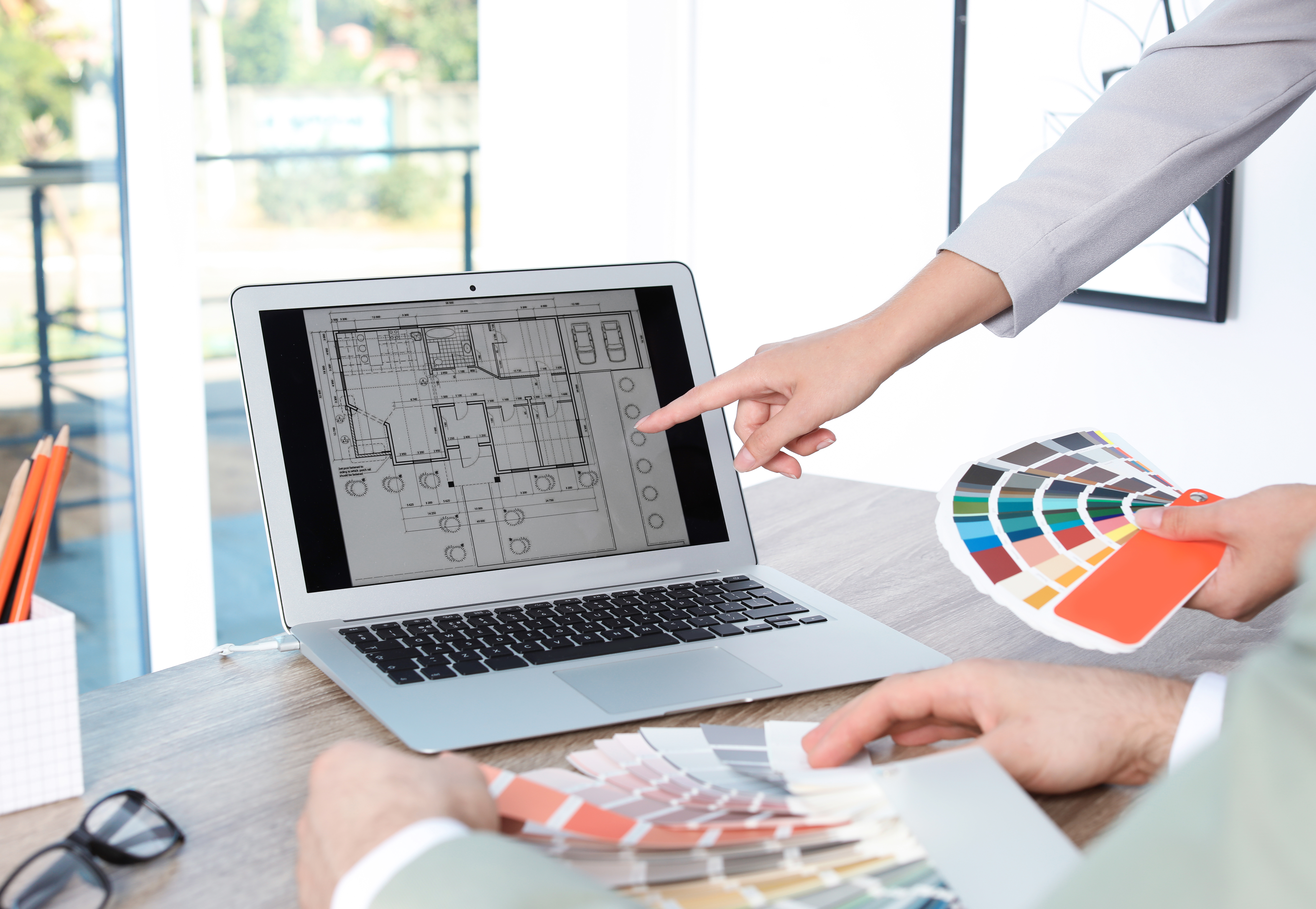 Homeowner reading interior designer reviews on Hausmark platform in Singapore