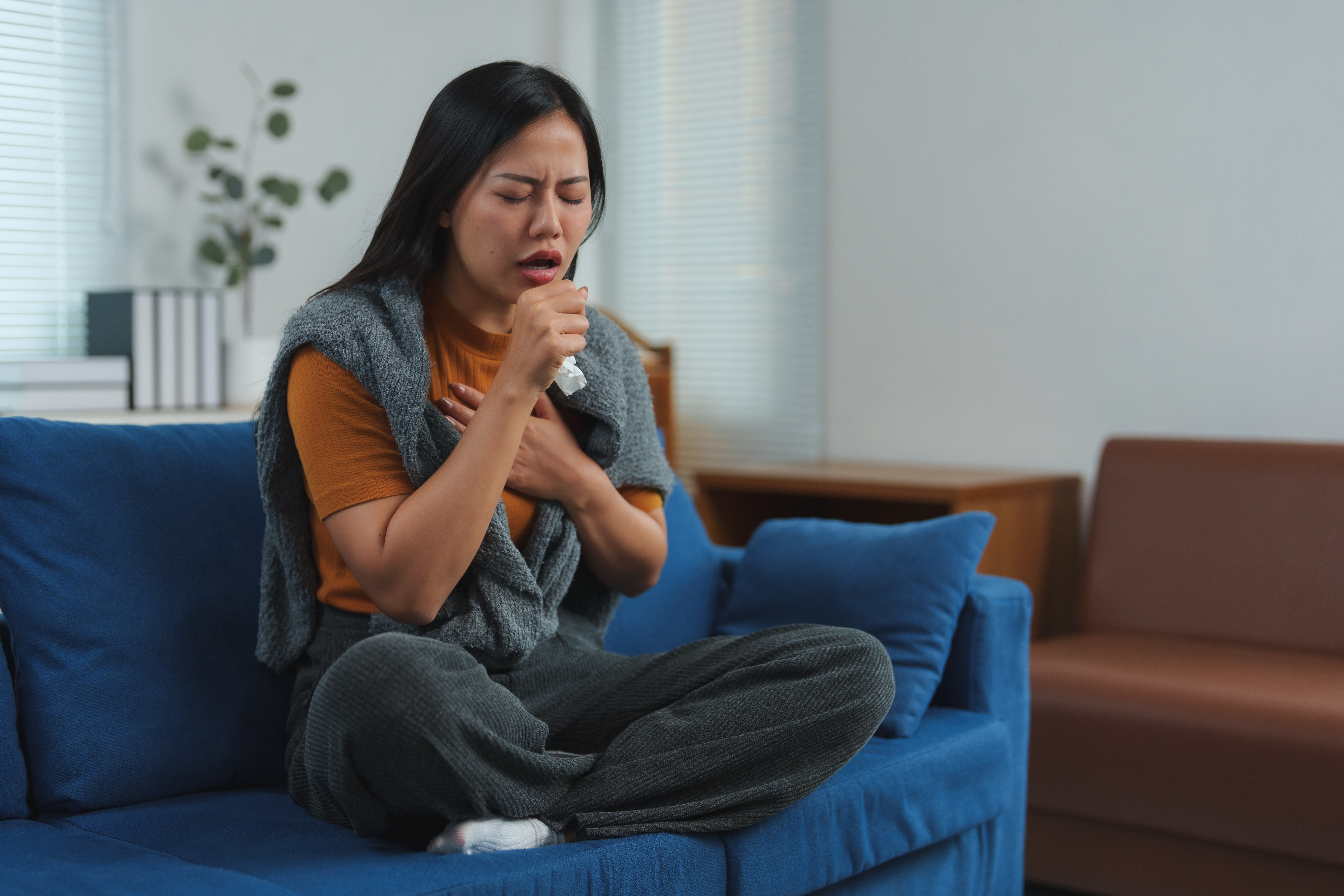 Illustration showing mucus hypersecretion in inflamed airways causing a persistent productive cough