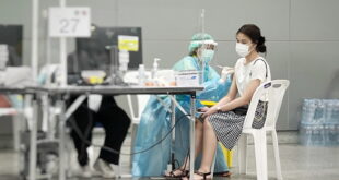 Patient consulting doctor for travel vaccination in Singapore
