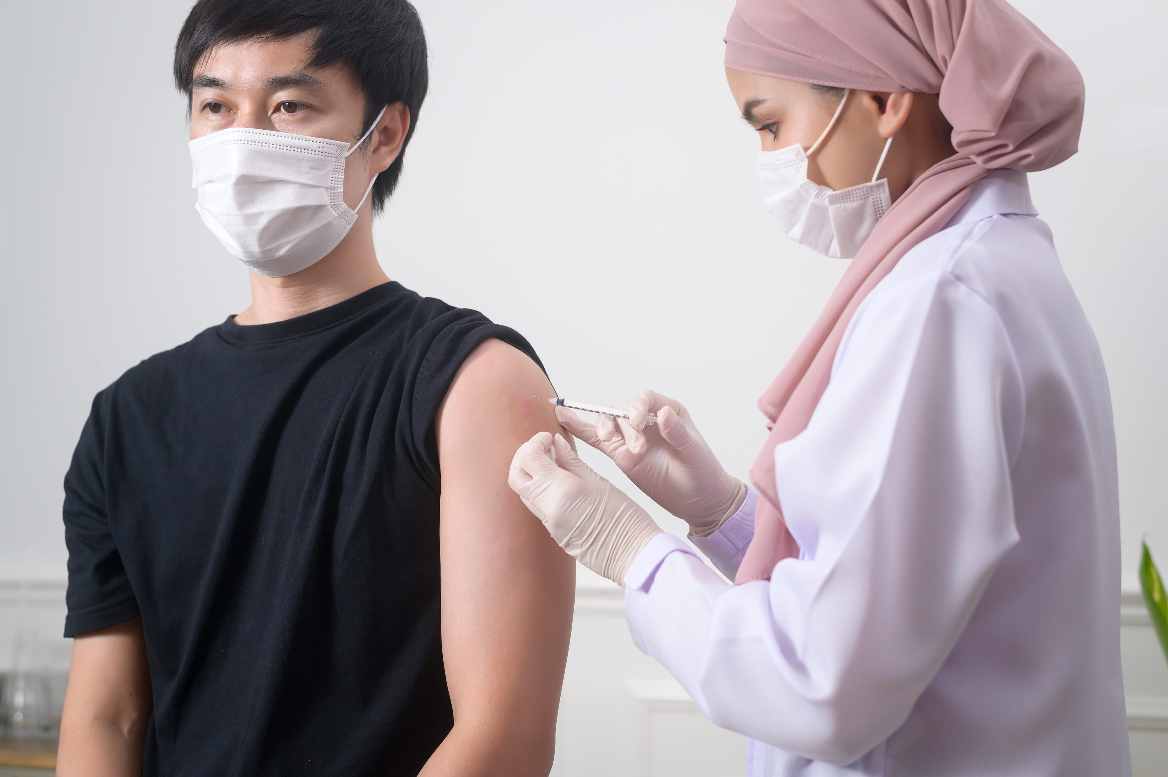 Teenager receiving vaccine at a private vaccination clinic in Singapore